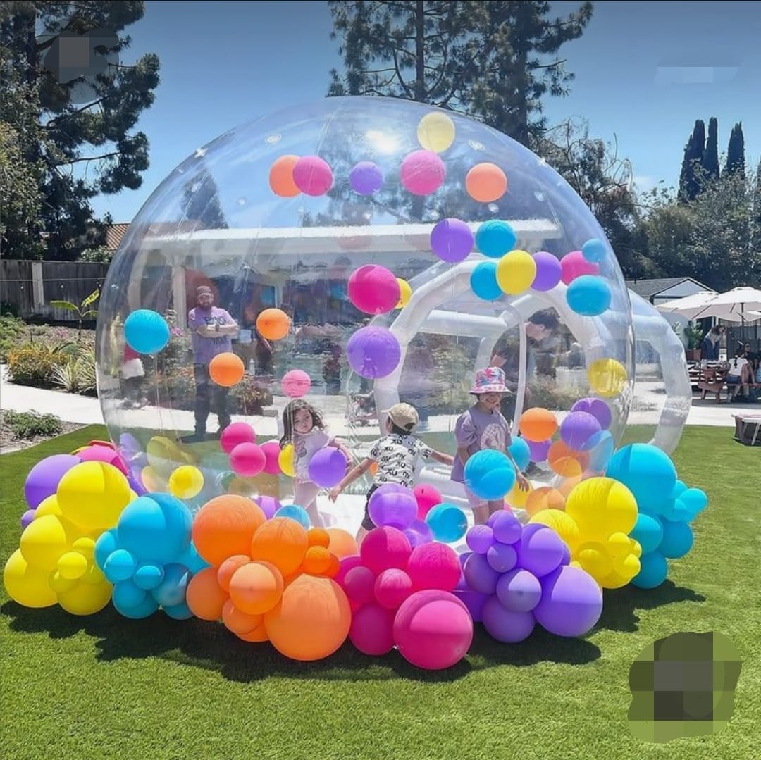 Inflatable igloo with flying balloons inside, designed for kids’ parties and magical events
