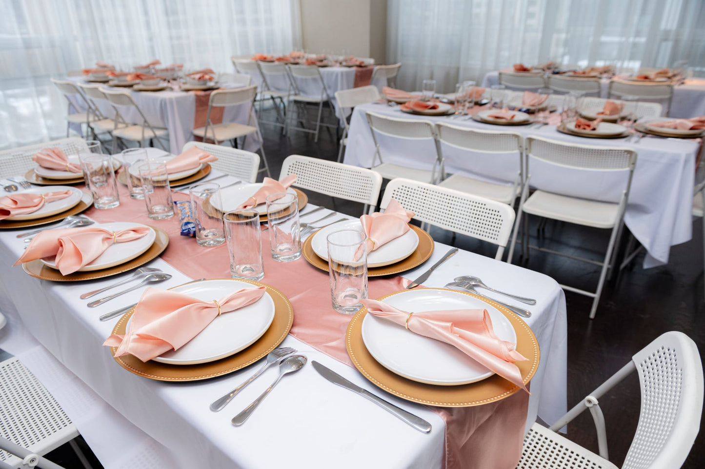 Event plates set of 12 stacked on a decorated banquet table