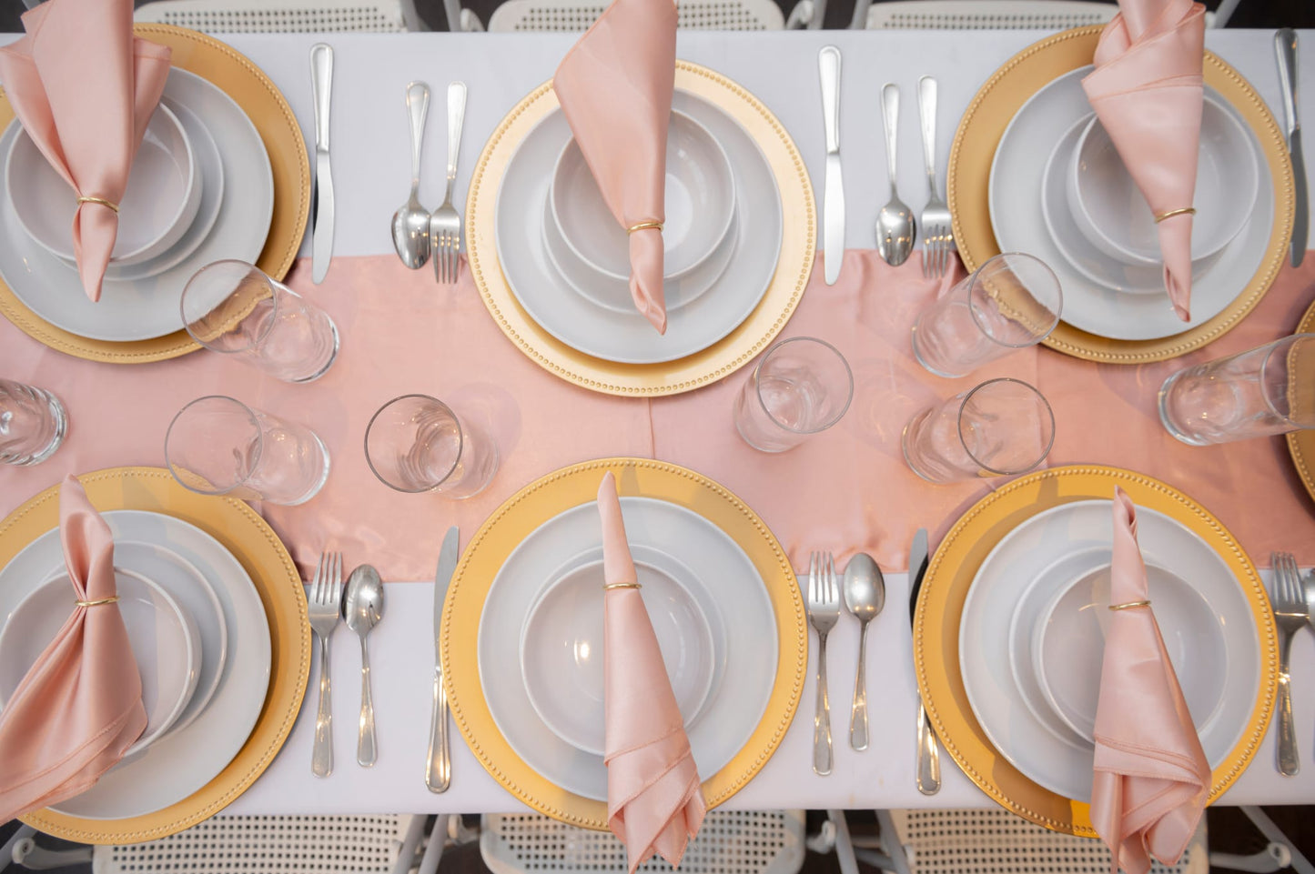 Event plates set of 12 stacked on a decorated banquet table