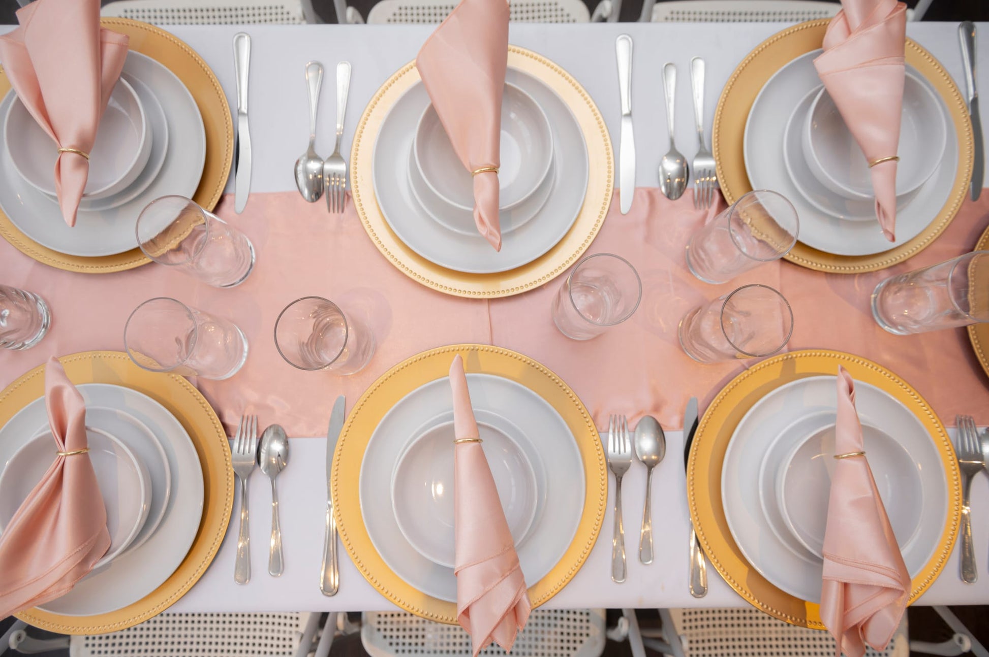 Event plates set of 12 stacked on a decorated banquet table