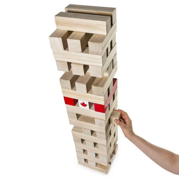 Giant jumbling tower game setup outdoors for guests to enjoy during a party or event