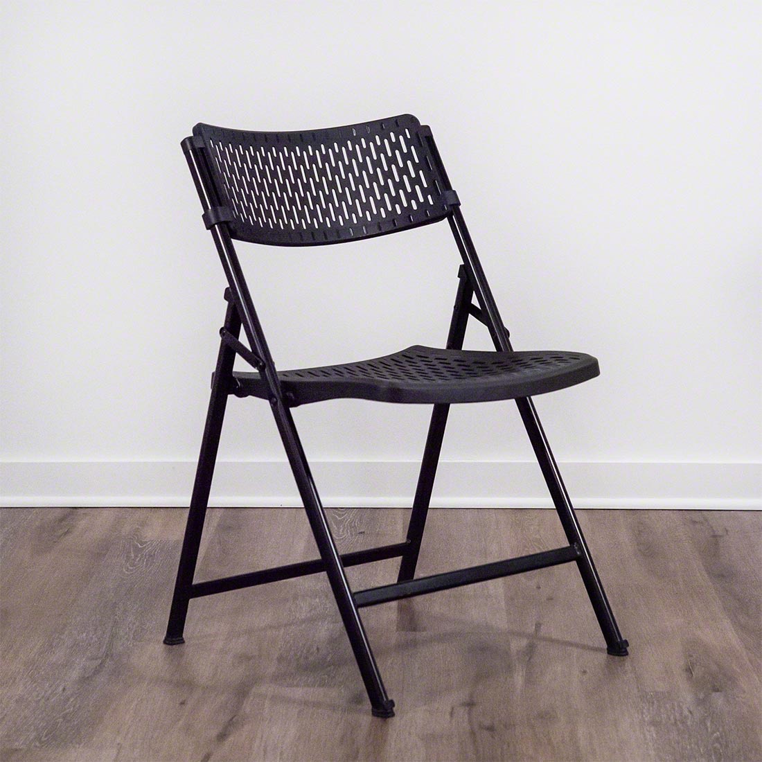 Folding black event chair with plastic seat and strong metal frame for indoor and outdoor use