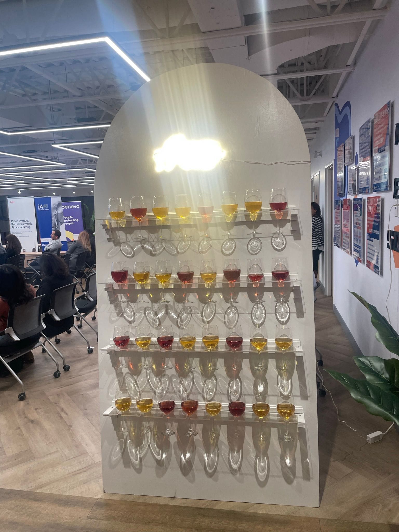 Cup holder stand for event entrances with champagne glasses displayed on a wooden frame