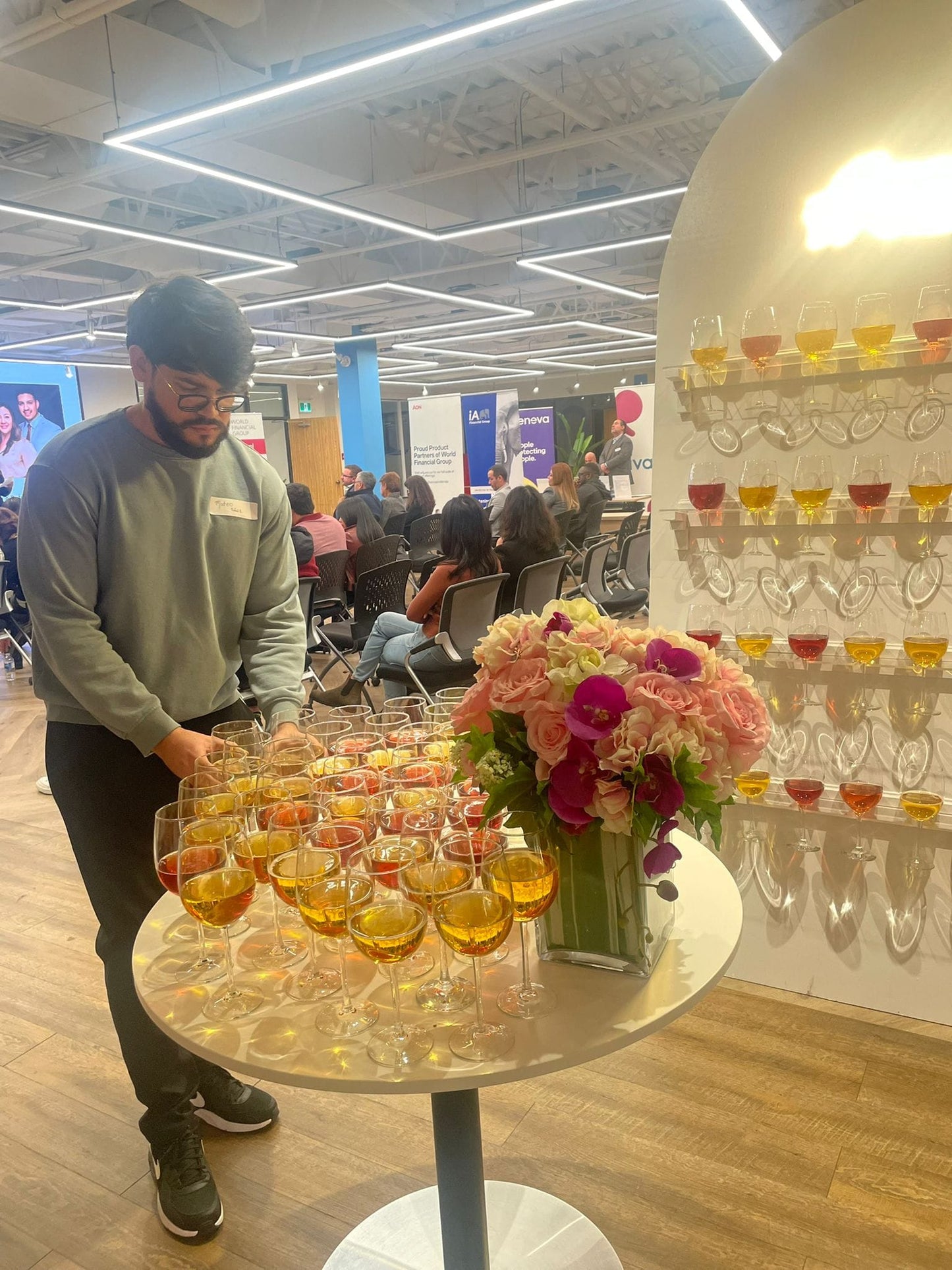 Cup holder stand for event entrances with champagne glasses displayed on a wooden frame