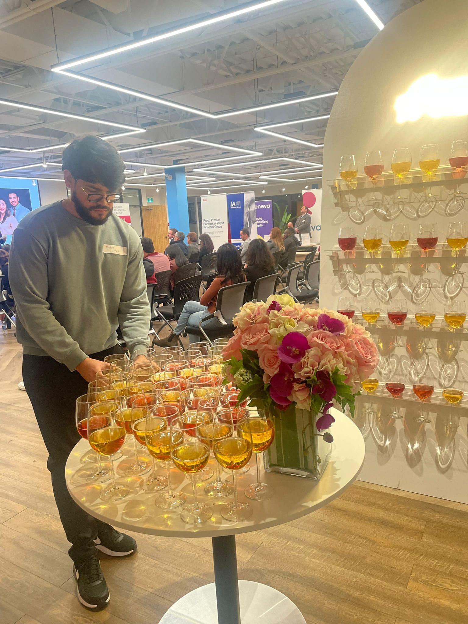 Cup holder stand for event entrances with champagne glasses displayed on a wooden frame