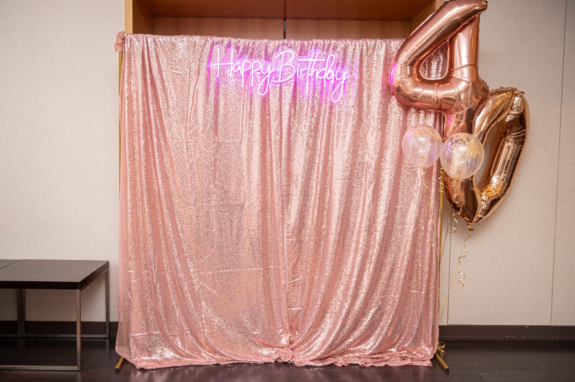 LED Happy Birthday sign for events glowing in white against backdrop