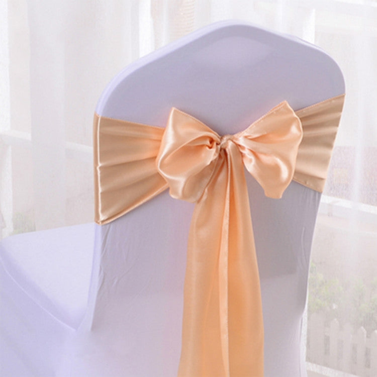 Satin silk chair sash in assorted colors tied around a white folding event chair