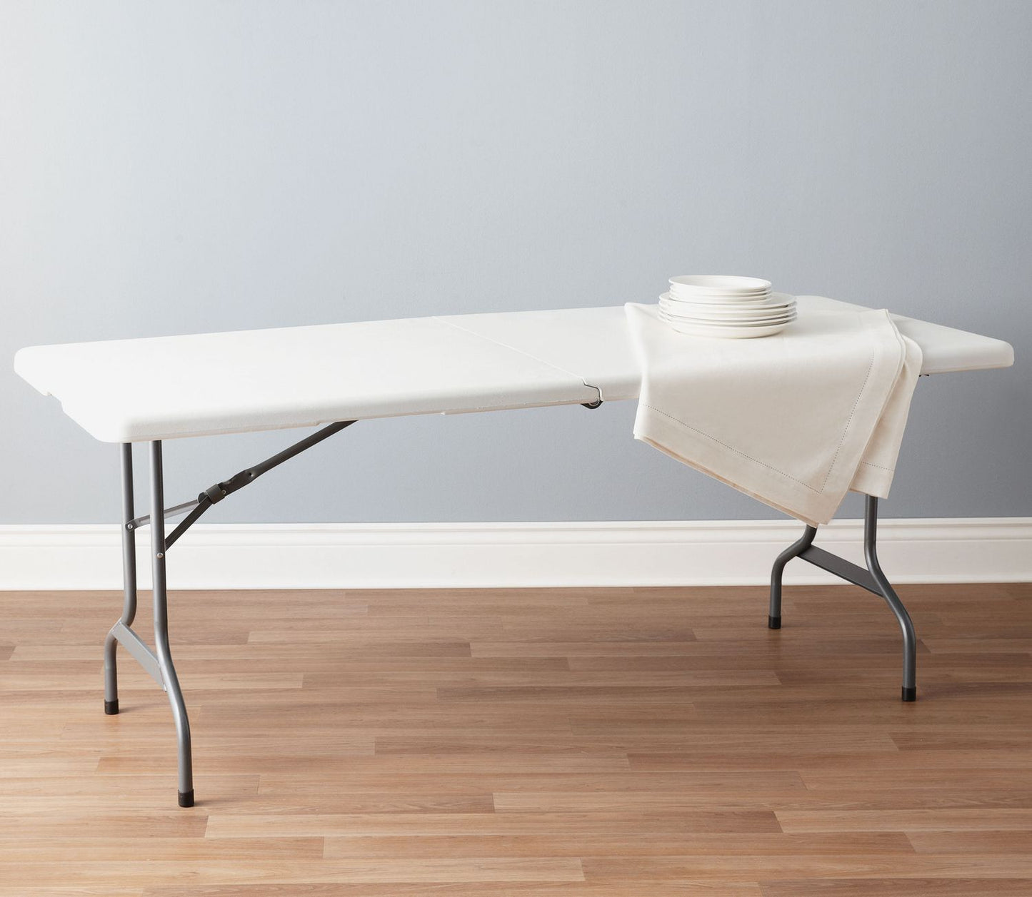 6 ft folding table with white plastic top and black metal frame for indoor and outdoor events
