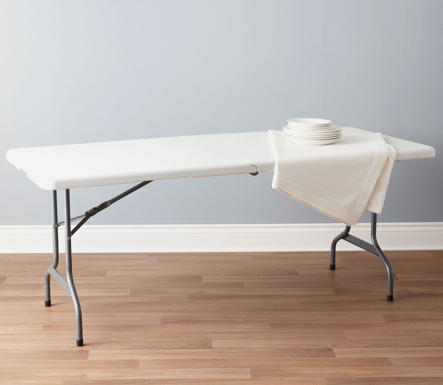 6 ft folding table with white plastic top and black metal frame for indoor and outdoor events